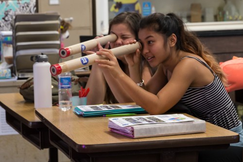 Hilo High students explore the world through a small telescope that they assembled.