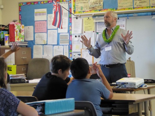NASA Scientist Joe Minafra shares rocks from space with a class of 6th graders at Honoka‘a Elementary School.