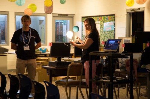 Gemini Astronomers Olivier Guyon and Kathy Roth (left to right) modeled how light hits orbiting bodies for students at Waiākea High School.