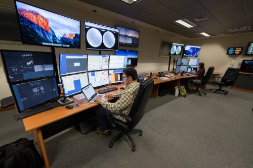 Support Specialists Javier Fuentes (left) and Joy Chavez (right) operate the Gemini South telescope from the Base Facility in La Serena.