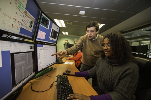 Raquel Nascimento and her colleague Rodrigo Carrasco at the Gemini South Base facility control room in La Serena.